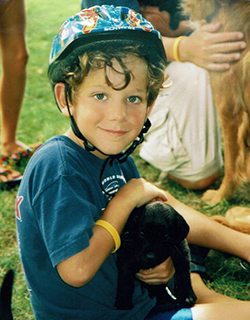 Louie as a young boy with his dog, Tink