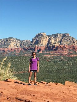 Hannah leads a busy, active life with activities like hiking thanks to TPN