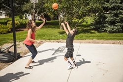 Garrett plays basketball with his sister thanks to support from orthotics