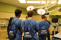 students listen to instructors at scrubs camp at St. Paul College