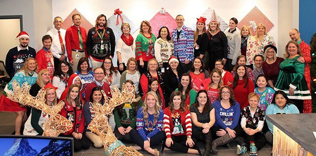 Staff dress up in their best holiday sweaters