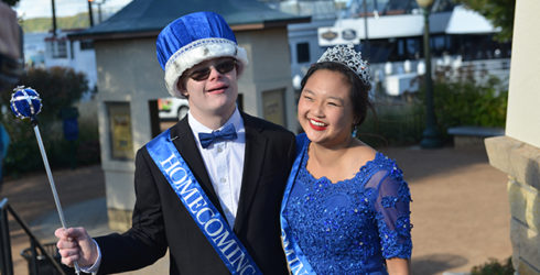 Lucas celebrates being homecoming king with his classmate